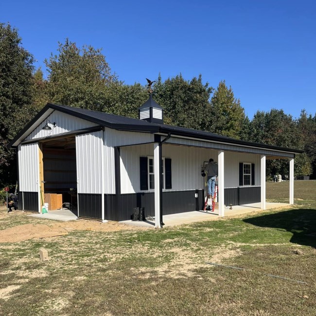 White home with newly installed exrterior and roofing by Lins Construction